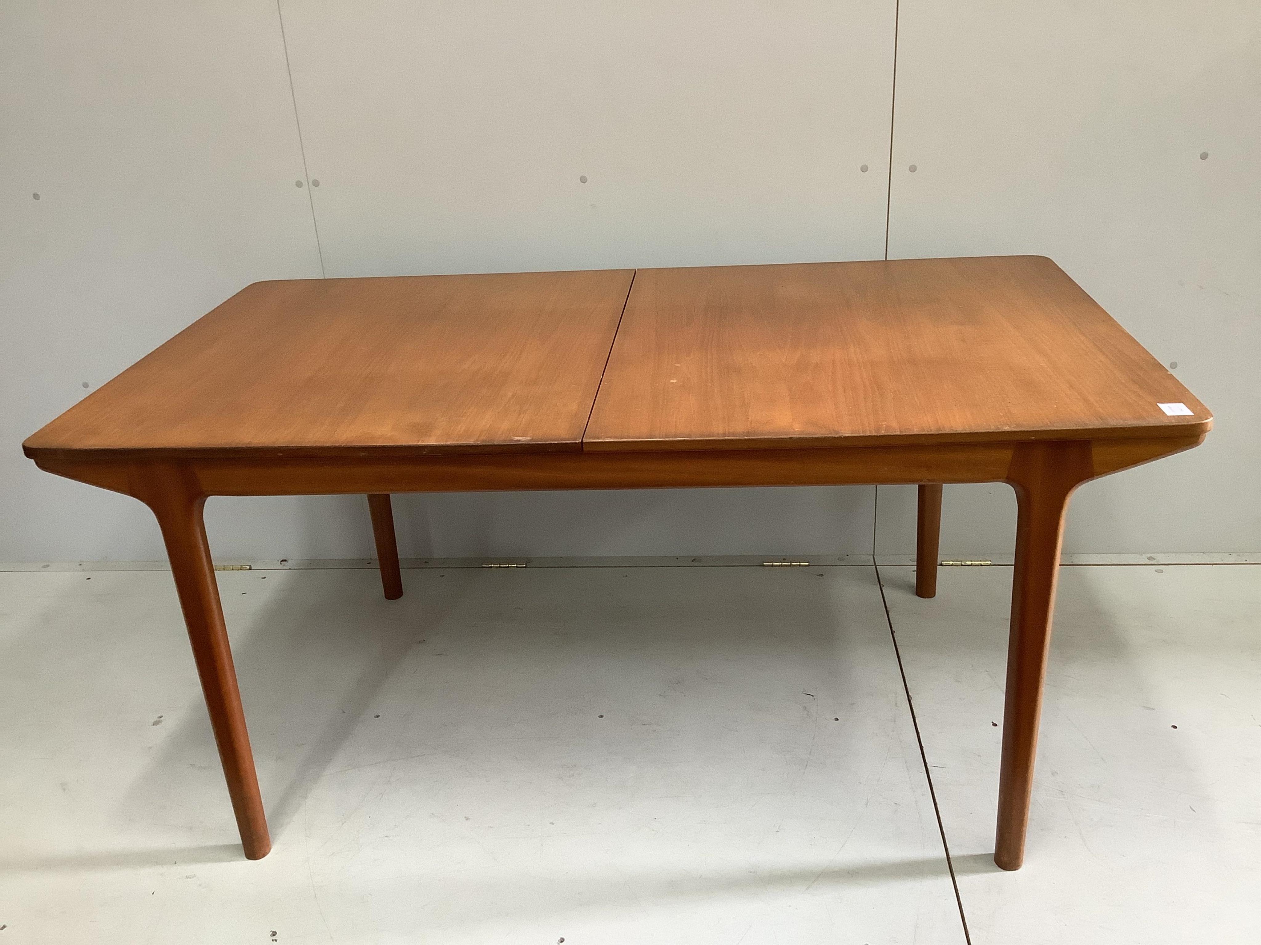 McIntosh of Kirkcaldy, a mid century teak extending dining table, width 159cm, depth 89cm, height 74cm. Condition - good